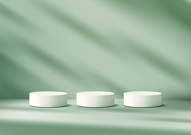 istock white cylindrical podiums on light green surface elegant product display mockup showroom showcase 2221069504