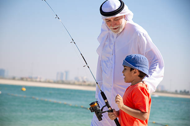 istock Two generations fishing together 2221072945