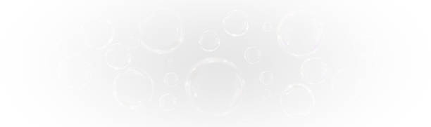istock Transparent 3D soap bubbles float in the air with iridescent rainbow hues and soft textures 2221073535