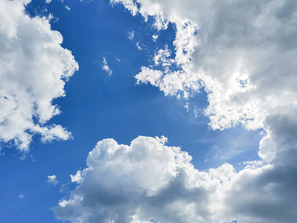 istock Bright blue sky with fluffy white clouds creating a serene and tranquil atmosphere above 2221074888