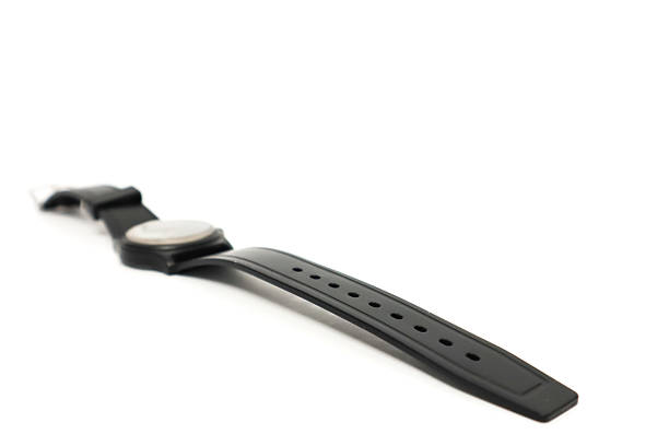 A black wristwatch isolated on white, showing modern design and simplicity