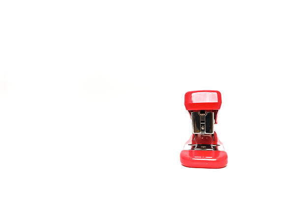 A stapler and white paper