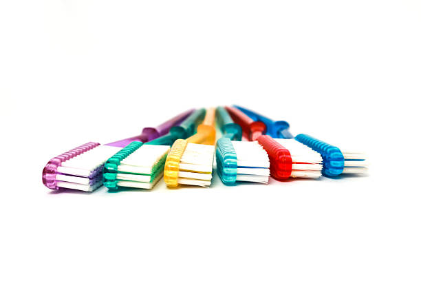 istock Colorful toothbrushes for oral hygiene arranged creatively on a white background 2221077186