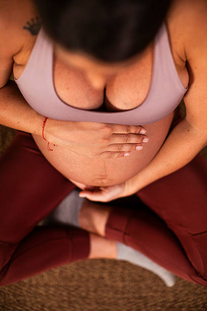 istock Pregnant Woman Practicing Relaxing Yoga 2221077836
