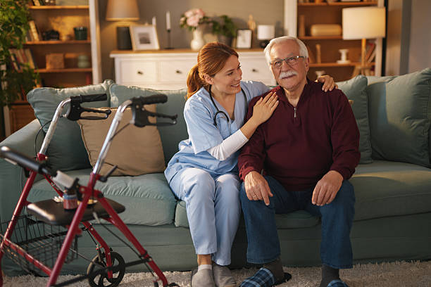 istock Home nurse comforting senior man on sofa at home 2221079548