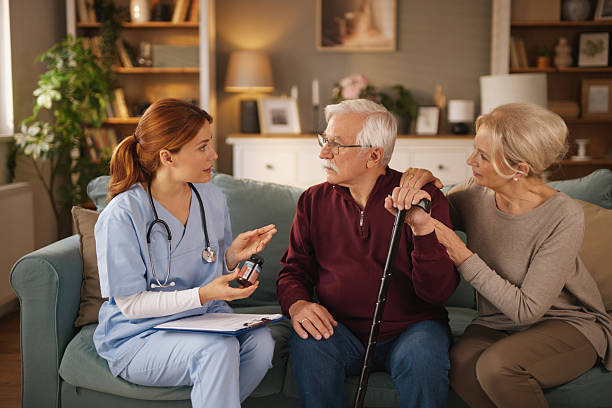 istock Nurse explaining medication to senior couple at home 2221081357