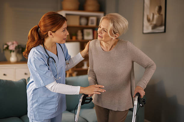 istock Nurse assisting senior woman using walker in home care setting 2221082197