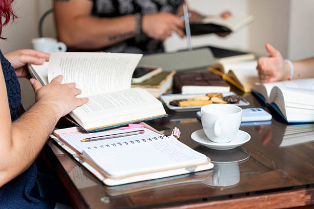 istock Writers reading and sharing notes during book club meeting 2221085450