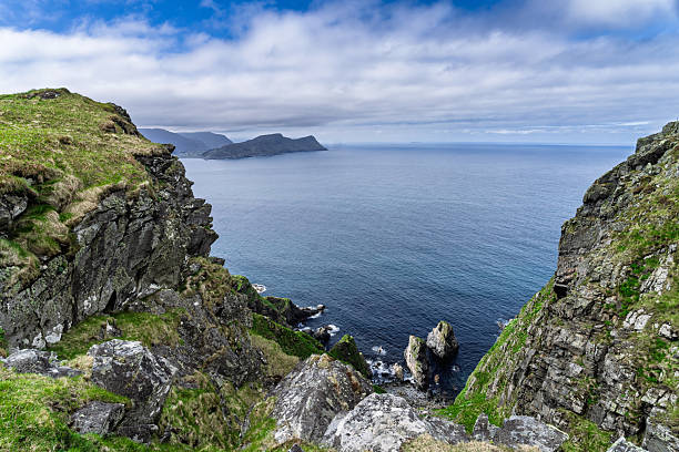 istock Steep Ocean Cliff With Seabirds and a Serene Sea Horizon, Runde, Norway 2221087498