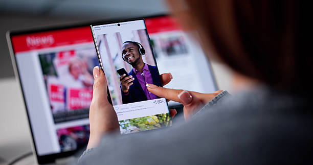 istock Social Media Manager Scrolling Updates On Smartphone 2221089892