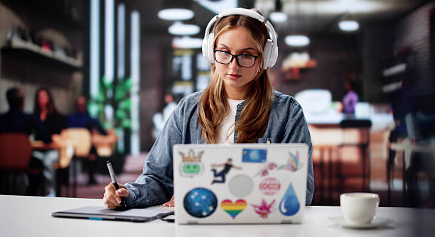 istock Busy Female Student Designs Graphics Online With Laptop 2221089953