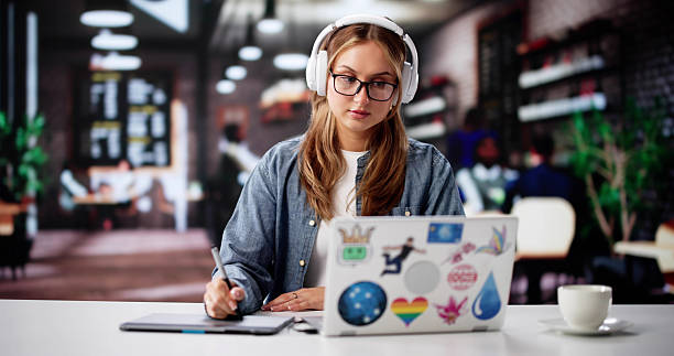 istock Busy Female Designer Typing Away On Her White Laptop 2221089976