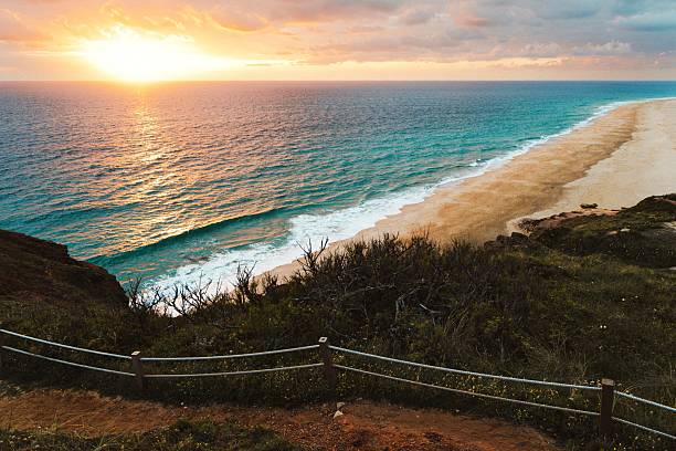 istock Beach sunset with golden sands and vibrant ocean. 2221095420
