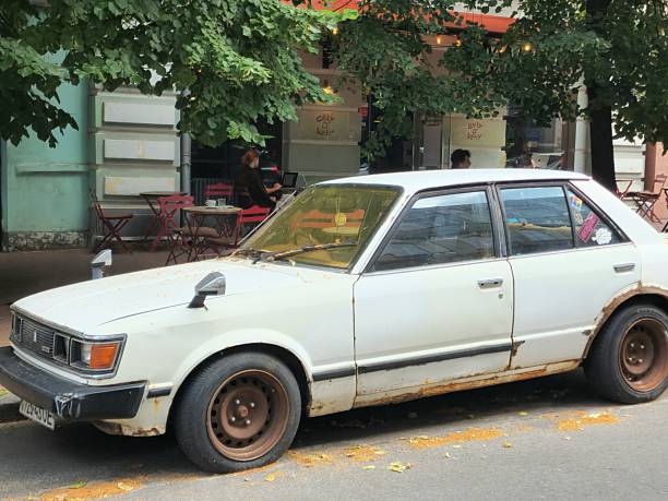 Kyiv, Ukraine - June 19 2025: old rusty retro Toyota Carina parked on street
