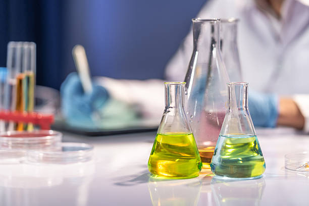 istock Colorful Chemical Solutions in Laboratory Glassware 2221099769