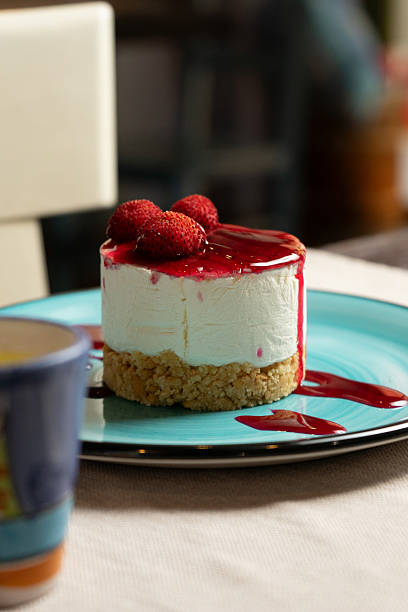 Sweet strawberry cheesecake on a table at the restaurant