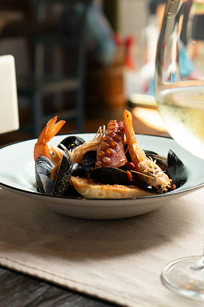 istock Fish soup with octopus and mussels on a table at the restaurant 2221107164