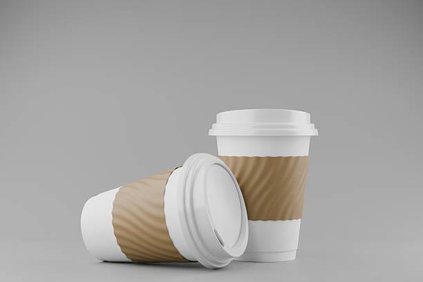 istock two paper coffee cup with lid blank label on gray background. 2221107224