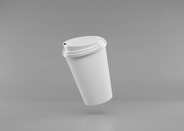 istock blank white paper coffee cup with lid on gray background, take away coffee cup mock up. 2221107248