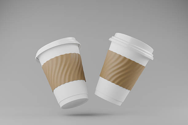istock two paper coffee cup with lid blank label on gray background. 2221107253