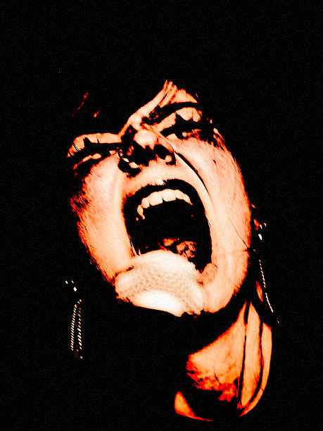 istock Screaming Singer in Intense Stage Lighting – Extreme Emotion Close-Up 2221117249