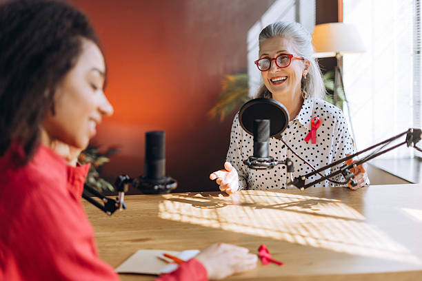 istock Radio host interviewing guest about breast cancer awareness in recording studio 2221119515