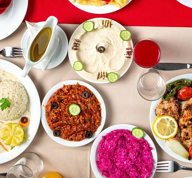 istock Assorted oriental appetizers hummus muhammara and sweet red cabbage salad. 2221121463