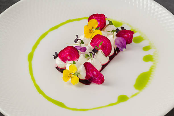 istock Colorful beetroot slices with goat cheese, garnished with edible flowers 2221124070