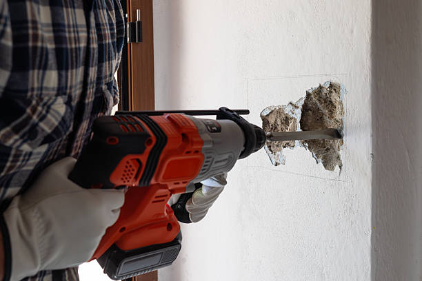 istock Carpenter electrician working with demolition hammer. Electricity. 2221125168