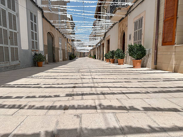Quiet town street decorated with white pennants