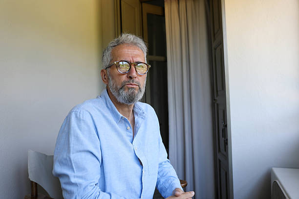 istock A senior man with glasses looking thoughtful 2221125972
