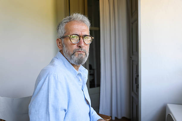 istock A senior man with glasses looking thoughtful 2221125985