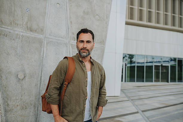 istock Confident middle-aged male standing casually in urban setting 2221129245