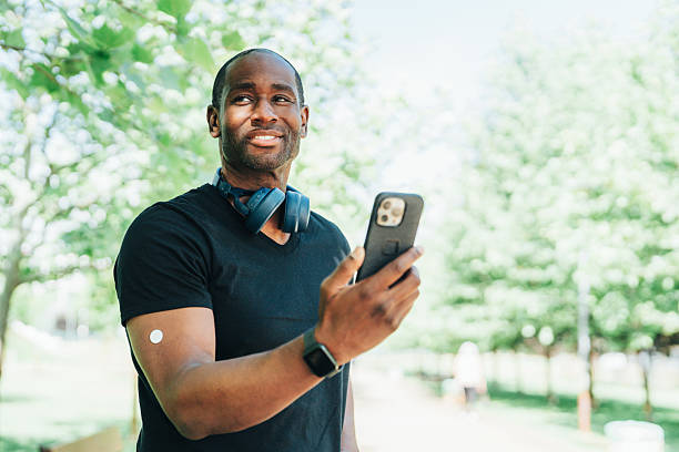 istock Young man watching mobile phone after outdoor gym training in park 2221131437