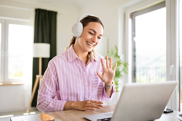 istock harming Woman Having an Online Meeting from Home 2221133657