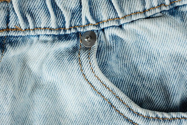 istock Macro Texture Blue Natural Denim. Metal Denim Tack Button 2221135470