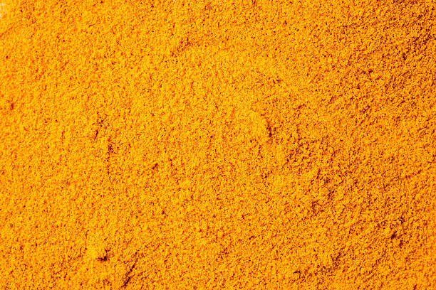 istock Turmeric with its magnificent orange color on a white background 2221136069