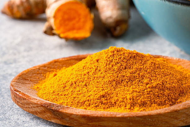 istock Turmeric with its magnificent orange color on a vintage white background 2221136107