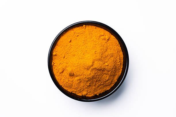 istock Turmeric with its magnificent orange color on a white background 2221137079