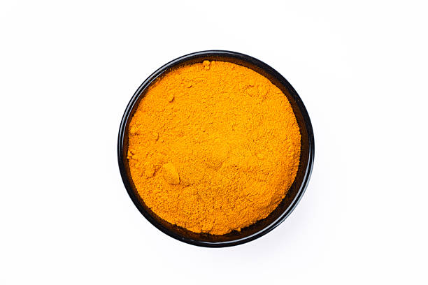istock Turmeric with its magnificent orange color on a white background 2221137082