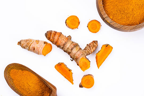 istock Turmeric with its magnificent orange color on a white background 2221137695