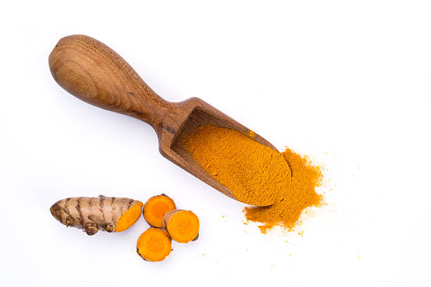 istock Turmeric with its magnificent orange color on a white background 2221137842