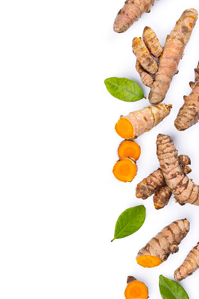 Turmeric with its magnificent orange color on a white background