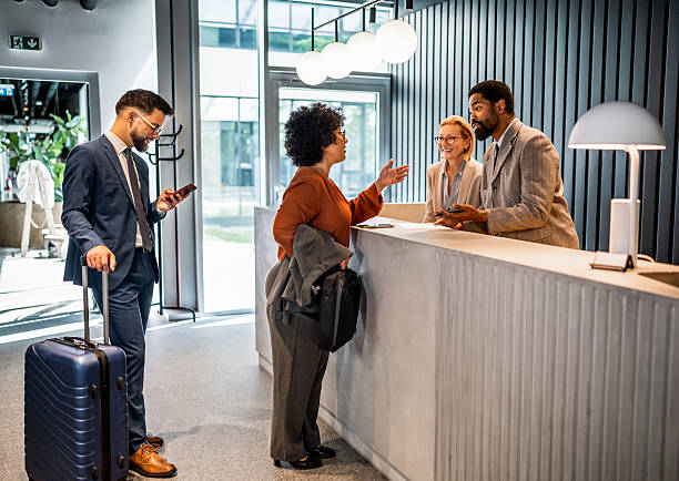 istock Businesswoman checking in at hotel reception 2221138810