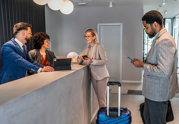istock Businesswoman checking in at hotel reception 2221139755