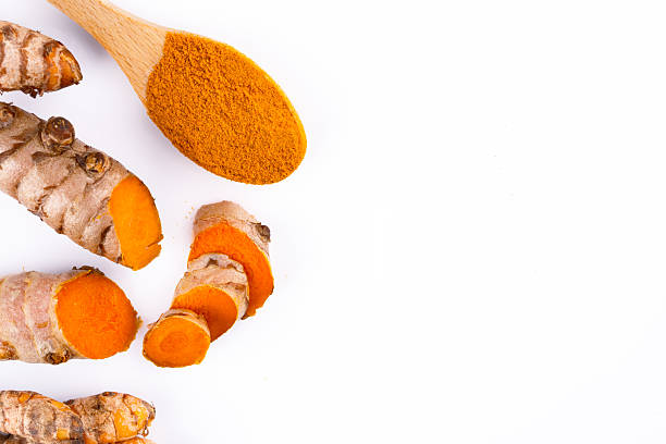 istock Turmeric with its magnificent orange color on a white background 2221142496