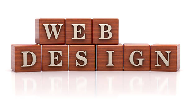Wooden blocks spelling web design on a white background, representing digital creativity