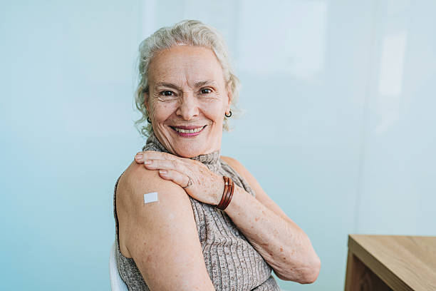 istock Woman showing vaccinated arm 2221143605