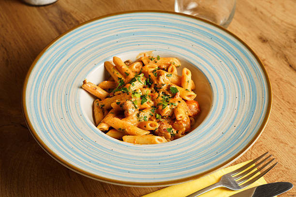 istock Creamy penne pasta with sausage and herbs 2221143675