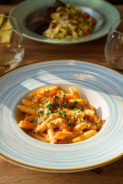 istock Creamy penne pasta with sausage and herbs 2221143685